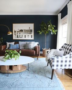 a living room with two couches, a coffee table and a rug on the floor