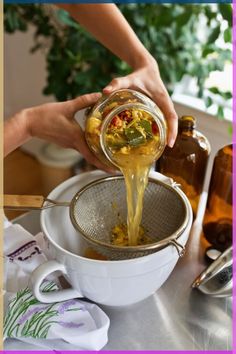 a person pours some liquid into a strainer