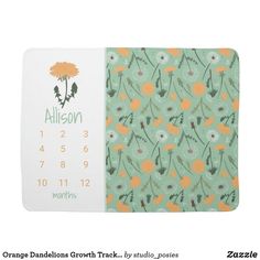 a calendar with an orange flower on the front and green floral pattern on the back