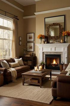 a living room filled with furniture and a fire place in front of a mirror on the wall