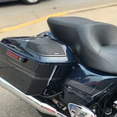 the back end of a motorcycle parked in a parking lot