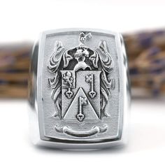 Our raised custom family crest signet ring is a unique way to show off your heritage. Upload your own family crest design and we'll design it and manufacture a ring like this but with your own crest. Choose from silver, gold or platinum, this is a family crest signet ring that will be passed down generations. Family Crest Design, Family Crest Ring, Custom Signet Ring, Crest Design, Family Crest, Hand Engraving, Signet Ring, Show Off, A Family