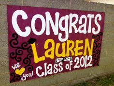 a sign that says congrats lauren we are you class of 2012