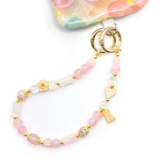 PRICES MAY VARY. 【Cute Phone Charm Pink】: Decorated with foral beads and adorable stones, this chic wrist strap for phone makes your items stand out from the crowd and brings you a happy mood every time you look at it due to its unique trendy design. 【Anti-drop and Anti Theft Phone Strap】: The cell phone wristlet strap effectively protects your phone from slipping, dropping, or being stolen in travel and daily life. Your phone can be easily found and kept in your hands, adding a more fashionable Trendy Beaded Wristlet For Everyday Use, Pink Rectangular Wristlet Perfect For Gift, Pink Phone Keychain, Pink Phone Bag With Detachable Strap For Everyday Use, Trendy Pink Wristlet With Keychain, Pink Phone Bag With Detachable Strap, Pink And White Phone Charm, Phone Charms Strap, Cute Pink Phone Charm