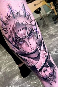 a person with a tattoo on their leg that has an image of the character naruta