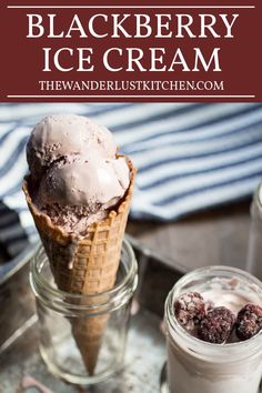 an ice cream sundae in a glass jar with two scoops on the side