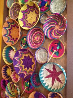 several baskets are arranged on a table with straws in the shape of starbursts