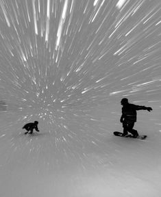 two people are snowboarding in the middle of a large star filled sky that is black and white