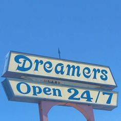 a sign for a restaurant that says dreamers open 24 / 7