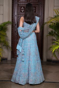 Light blue blouse with all-over floral hand embroidery. Paired with embroidered lehenga and dupatta.
Component: 3
Embroidered
Neckline: Sweetheart
Sleeve Length: Sleeveless
Fabric: Tulle
Color: Blue
Kalidar floral bead work embroidery
Cutwork hem blouse
Kamar latkans
Latkans at the dupatta - Aza Fashions Fitted Blue Lehenga With Chikankari Embroidery, Fitted Blue Chikankari Embroidery Lehenga, Blue Choli With Chikankari Embroidery For Wedding, Semi-stitched Blue Lehenga With Chikankari Embroidery, Blue Lehenga With Chikankari Embroidery, Festive Blue Chikankari Lehenga, Bead Work Embroidery, Floral Hand Embroidery, Light Blue Blouse