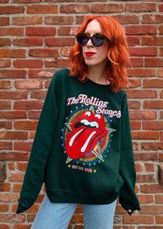 START ME UP! Soft, slouchy raglan crew sweatshirt featuring colorful Rolling Stones US Tour 1981 graphics at front. Lightweight (not bulky) with a classic fuzzy lining inside. Vintage hunter green colorway. Features: Slouchy, relaxed fit sweatshirt Crew neckline Long raglan sleeves Ribbed cuffs on sleeve Banded hem Colorful Rolling Stones graphics at front Hunter green colorway Lightweight with fuzzy lining inside Officially licensed Ethically made in California Brand & Fabric Content: Brand: Da Ankle Length Skirt, Ragged Priest, Skirt Jumpsuit, Workout Sweatshirt, Girl Bands, Crew Sweatshirts, Dress Pant, Hunter Green, Rolling Stones