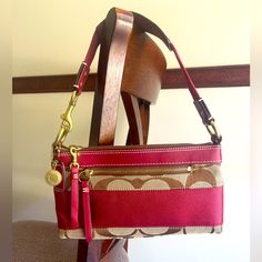 Never Been Used, In A Beautiful Deep Red Tone. Features: Top Zip Closure Center Zipped Pocket Red Inner Lining Pretty Shoulder Strap Gold And Red Details Smoke Free Home New Without Tags Everyday Red Shoulder Bag With Zipper Pouch, Red Bags With Zipper Pouch, Red Clutch Bag With Zipper Closure, Red Clutch Shoulder Bag With Zipper Closure, Coach Clutch Bag With Zipper Closure, Coach Pouch Shoulder Bag With Zipper Pocket, Red Tone, Red Details, Gold And Red