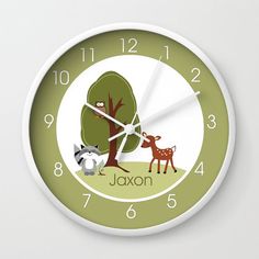 a wall clock with an image of a tree and two animals