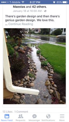 a stream running through a yard next to a house