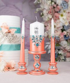 This turquoise and coral unity candle ceremony set provides an enchanting blend of romantic colors to elevate your special day. Curated with love, this all-inclusive set features all you need to commemorate your newlywed status. The set includes beautifully crafted toasting flutes, a cake server set, a unity candle ceremony set, cake plates, and forks.