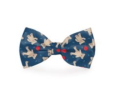 a blue bow tie with red dots and cartoon dogs on it, all over print