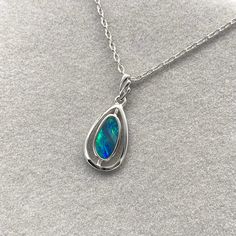 925 Sterling Silver Natural Australian Boulder Opal Doublet Pendant Necklace | October Birthstone | Fine Gemstone Jewelry | Gift Jewelry Opal is the queen of gemstone, which is one of the most beautiful gemstones in the world. Every piece of opal is unique. Its optical effect is Play-of-Color, which shows a vivid play of iridescent color. The colors change when the stone is viewed with various angles. We only use natural opal (no synthetics) for our jewelry. This elegant pendant necklace is simple, delicate and comfortable for all day wear. ABOUT THE PRODUCT ITEM DIMENSION : 25x11mm OPAL SIZE : 11x6mm COLOR : Blue-green  PATTERN :  Flash with pattern  OPAL TYPE : Boulder Opal Doublet OPAL LOCALITY : Coober Pedy, Australia METAL: 925 Sterling Silver with Rhodium-plated ~FOR FREE ~ * Brass N Blue Opal Necklace, Iridescent Color, Beautiful Gemstones, Jewelry Opal, Australian Boulder Opal, Elegant Pendant, Rock Collection, Brass Necklace, October Birthstone