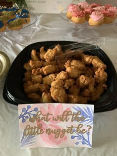 a plate full of fried food next to a sign that says what with the littlefingers be?