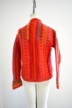 "Description: 1990s funky wool cardigan sweater. Hand knit in Nepal. Button front with knit covered buttons. Long sleeves. It has stitched designs and wood bead accents. Two front pockets with knitted fringe. Oversized fit. Condition: In great condition, with no stains or holes. Designer: Newari Stated size: S/M (can fit up to a size Large based on the measurements) Measurements: Armpit to armpit: 21\" Shoulder to shoulder: 17\" Sleeve length: 24\" Overall length: 23.5\" Waist: up to 40\" ---&gt Wool Cardigan, Stitch Design, Covered Buttons, Wood Beads, Cardigans For Women, Oversized Fits, Cardigan Sweater, Nepal, Hand Knitting