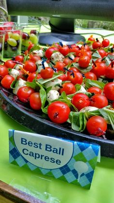 a platter filled with lots of different types of food on top of a table