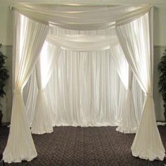 an image of a wedding ceremony setting with white drapes