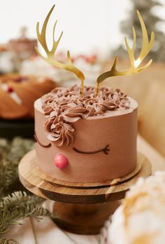 there is a chocolate cake with antlers on it