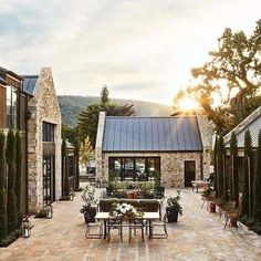 an outdoor patio area with tables and chairs