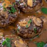 some meatballs with mushrooms and sauce in a pan