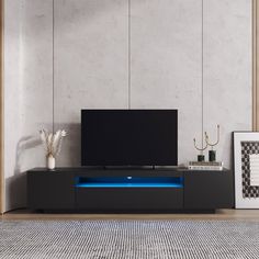 an entertainment center with a blue light under it