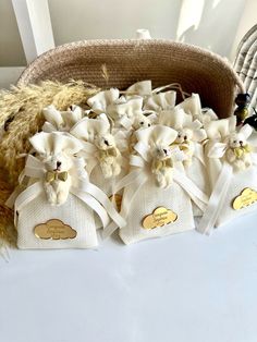 small bags with teddy bears in them sitting on a table