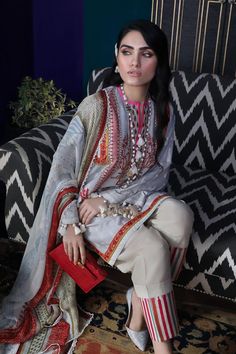 Pakistani designer slub outfit is added to store with beautiful embroidered work and prints. Cloud grey shirt with white paste printed motifs is modernized by embroidery in pops of color on slub fabric. Over all shirt is embellished with embroidered orange borders. Trouser: Elegant printed trouser in cream color is also added with this graceful dress to highlight your grace in autumn season. Cotton trouser is paired with lining printed borders. Dupatta: Digitally printed chiffon dupatta in black Gray Festive Sets With Resham Embroidery, Festive Embroidered Gray Sets, Festive Unstitched Gray Kurta, Gray Traditional Sets With Chikankari Embroidery, Gray Designer Wear Sets For Eid, Gray Chikankari Embroidery Traditional Sets, Traditional Gray Chikankari Embroidery Sets, Festive Gray Sets With Chikankari Embroidery, Designer Gray Sets For Eid