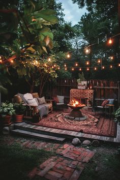 an outdoor fire pit surrounded by patio furniture and string lights in the evening time,