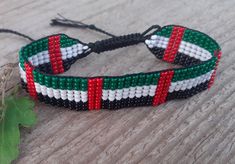 Loom beaded bracelet with United Arab Emirates, Fujairah Emirate flag. Patriotic hand woven beaded wristbandt is a great gift for a women, girl or child for birthday, Christmas, Valentine's Day and other holidays. Small frienship gift whis Middle East country flag. Is suitable for daily wear. Bracelet in stock and ready to ship. More bracelets here: https://www.etsy.com/shop/BeadSeeShop?ref=seller-platform-mcnav&section_id=30144819 The bracelet is made of Czech seed beads and strong nylon thread Duy Beni Bracelet, Multicolor Beaded Bracelets As Independence Day Gifts, Multicolor Beaded Bracelets For Independence Day Gift, Uae Flag Day Ideas, United Arab Emirates Flag, Emirates Flag, Flag Beads, Flag Bracelet, Bff Hands Aesthetic