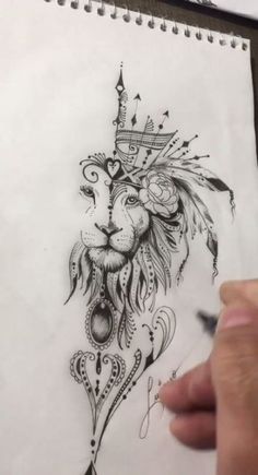 a drawing of a lion with a crown on it's head is being drawn