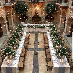 an overhead view of a dining hall with tables and chairs set up for a formal function