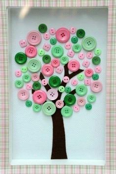 a tree made out of buttons on a white frame with pink and green plaid background