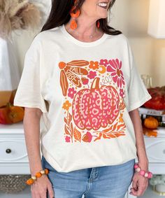 The "Fall Vibes Pink Leopard Pumpkin Graphic Shirt" is a must-have for embracing the cozy autumn season with a stylish twist. This natural-colored shirt features the words "Fall Vibes" paired with a trendy pink leopard-patterned pumpkin, adding a fun and fashionable flair to your fall wardrobe. Accompanied by delicate acorns and leaves, this design perfectly captures the essence of autumn.
Available in sizes YXS-5XL, this shirt is great for pumpkin patch visits, fall festivals, or any casual fall day. The pink leopard pumpkin brings a unique touch, blending seasonal charm with a bit of chic edge. Perfect for those who love to celebrate fall in style, it's a cozy and stylish way to welcome the season! Pumpkin Graphic, Leopard Pumpkin, Fall Festivals, Cozy Autumn, Autumn Season, Autumn Cozy, Pink Leopard, Fall Festival, Graphic Shirt