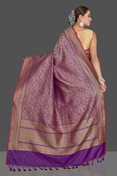 Be a vision of elegance on wedding occasions in this stunning purple tussar Banarasi saree! The saree has a beautiful overall zari work which makes oh-so-striking! It comes with a red blouse piece. Shop Banarasi sarees in USA from Pure Elegance. Disclaimer: The shown stitched blouse on the model is for display purpose only. The saree comes with a matching blouse piece and finished with fall and piko. The actual product may vary slightly from the image. These are custom orders, hence expect slight variation in color, placement of the motif or buta. ESTIMATED DELIVERYBecause this is a custom order, it would take about 4 weeks from the date of purchase. RETURN POLICYThis product is a custom order and cannot be returned or exchanged. Pure Elegance, Fashion Journals, Red Blouse, Banarasi Saree, Indian Saree, Zari Work, Traditional Fabric, Saree Online, Banarasi Sarees