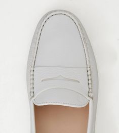 Tod's Gommino driving shoes in natural grain leather with exposed hand stitching, penny bar, hot-stamped monogram and iconic rubber pebble outsole. Available in a wide range of colors. Driving Moccasins Womens, Heel Care, Driving Moccasins, Driving Shoes, Vans Classic Slip On Sneaker, Keds, Vans Sneaker, White Leather, Hand Stitching