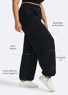 Embrace roomy wide legs and a stretchy fit for ultimate comfort, paired with a flattering high waist for added style. Whether it's grocery runs, lazy Sundays, or a casual hangout, these joggers have you covered in relaxed elegance. Versatile Baggy Sweatpants With Elastic Waistband, Baggy Cargo Pocket Joggers For Loungewear, Sporty Cotton Wide Leg Pants With Loose Fit, Sporty Cotton Wide Leg Pants With Loosely Fitted Hips, Black Stretch Pants With Functional Drawstring, Baggy Athleisure Bottoms With Drawstring, Baggy Drawstring Bottoms For Athleisure, Utility Sweatpants With Drawstring And Relaxed Fit, Utility Style Sweatpants With Drawstring And Relaxed Fit