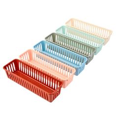 four plastic baskets sitting side by side on top of each other in different colors and sizes