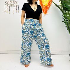 "Cotton Palazzo Pants, Summer Flowy Pants, Women Bohemian Trousers with Pockets, Spring Loose Hippie Lightweight Pants, Floral Prints Hit the summer in style with these lightweight floral Palazzo pants. Featuring bohemian-inspired prints and cotton fabric, the trousers provide all-day comfort with chic and boho flair. The flowy cuts and pockets allow for complete freedom of movement, so you can stay cool and stylish. Handmade Material: Organic Cotton  Size: Free Size and Plus Size Adjustable Waist Two Side Pockets Free Size: Length- Approx. 38\"                   Waist- Approx. 26\" to 40\"                    Hips- Approx. 44\"                   Inseam- Approx. 28\" Plus Size:  Length- Approx. 38\"                   Waist- Approx. 32\" to 48\"                   Hips- Approx. 48\" Spring Boho Print Harem Bottoms, Summer Harem Pants With Pockets, Casual Boho Print Pants For Vacation, Hippie Boho Print Vacation Bottoms, Bohemian Floral Print Beach Bottoms, Bohemian Floral Beach Bottoms, Summer Boho Print Harem Bottoms, Boho Print Harem Bottoms For Summer, Boho Print Hippie Pants For Vacation