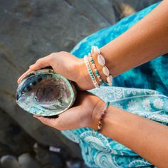 The Learn to Surf Howlite Bracelet is made with semi-precious stones and an adjustable cotton cord with three size options. Adjust to your perfect fit and snip off any excess cord. Colors: Cream White, Turquoise, Silver, Cream Cord Materials: Howlite, Turquoise, Coconut Button, Cotton Cord Length: 6.5" (first closure), 8.5" (last closure) Handmade by female artisans in Thailand. Bohemian Beaded Bracelets For Meditation With Sliding Knot, Bohemian Gemstone Beads Friendship Bracelets For Beach, Spiritual Hand Wrapped Turquoise Friendship Bracelets, Spiritual Hand-wrapped Turquoise Friendship Bracelets, Spiritual Turquoise Hand Wrapped Friendship Bracelets, Adjustable Turquoise Beaded Bracelets In Holistic Style, Adjustable Wrap Bracelet With Gemstones For Meditation, Spiritual Beaded Bracelets With Sliding Knot For Beach, Spiritual Turquoise Friendship Bracelets For The Beach