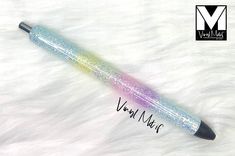 a pen that is laying on top of a fur covered surface with writing underneath it