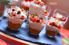 small cups filled with food sitting on top of a tray