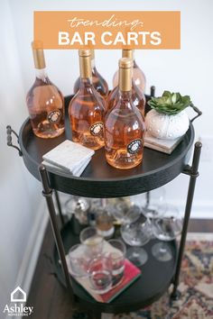 several bottles of wine on a black table