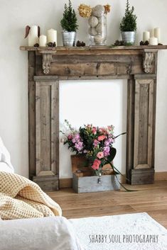 a bed room with a fire place and flowers