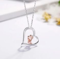 Product Details: Gorgeous mother/baby heart necklace, perfect for that special day. Set in 925 sterling silver with rose gold overlay. Style Heart, a mother holding a child. Chain size 18"inch. Pendant size 12mm long, and 8mm wide. Pave setting with AAA cubic zirconia, with faceted clear like a diamond. The polishing is manually to improve the shine and reflection of the pendant. IN STOCK. Mother Son Necklace, Mother Daughter Jewelry, Baby Heart, Mother Daughter Necklace, Nice Jewelry, Daughter Jewelry, Mother Baby, Daughter Necklace, Mother Birthday Gifts