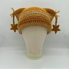 the hat is knitted with brown yarn