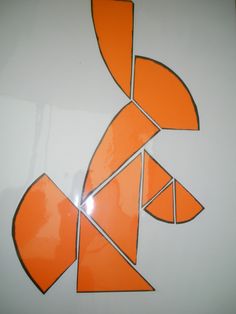 an orange and white design on the side of a wall